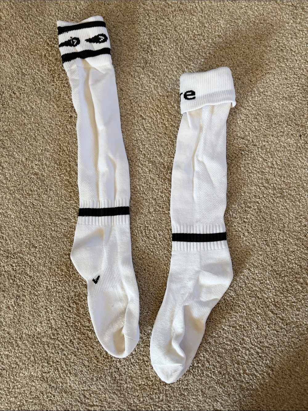 White Knee-High Athletic Socks with Black Stripe Accents